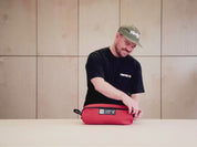 [autoplay] video showing the TentBox Camping Chair in red being taken out of its storage bag and assembled