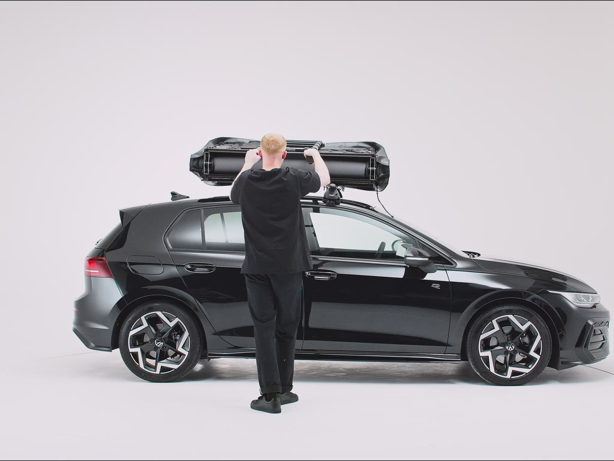A 360 view of the new TentBox Lite roof tent being opened and closed on the roof of a black car [autoplay]